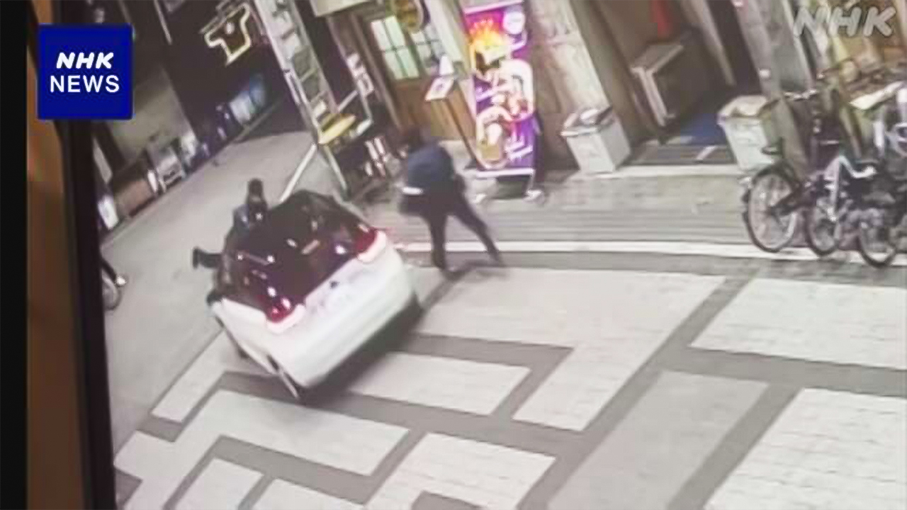 大阪車が警察官をボンネットに乗せたまま700m走る